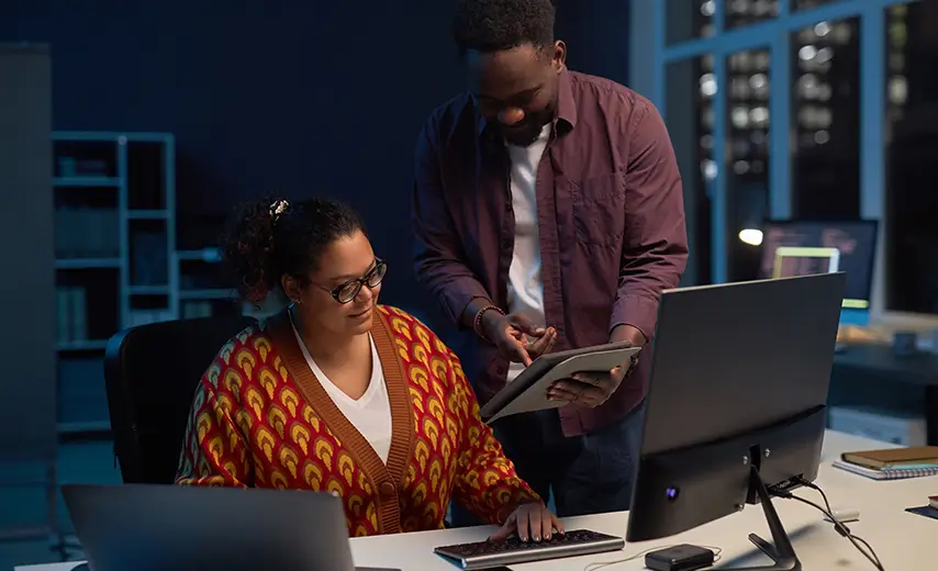 Shot of a man and woman using technical services